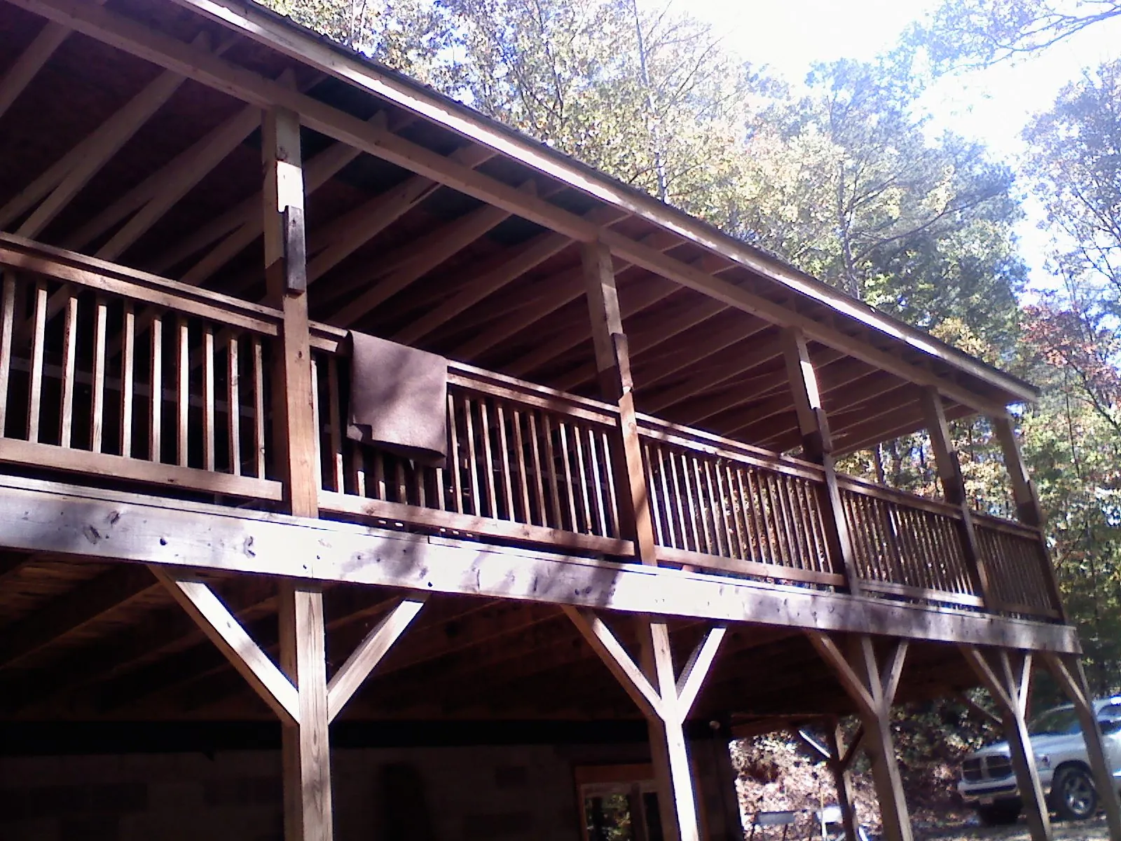 Timber framing under a new elevated porch and deck — Roof Leak Repair in Amana by Roofing Brothers
